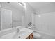 Bathroom features an undermount sink, shower, and framed mirror at 210 Mediate Dr, Raleigh, NC 27603