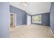 Bright primary bedroom features a vaulted ceiling, fan, and natural light at 210 Mediate Dr, Raleigh, NC 27603