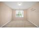 Spacious bedroom with a window and carpeted floors at 210 Mediate Dr, Raleigh, NC 27603