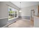 Cozy breakfast nook with a large window and neutral tones at 210 Mediate Dr, Raleigh, NC 27603