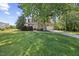 Charming home with a large front yard, mature tree, and a two car garage at 210 Mediate Dr, Raleigh, NC 27603