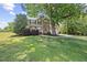 Charming home with a large front yard, mature tree, and a two car garage at 210 Mediate Dr, Raleigh, NC 27603