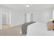 Cozy bedroom with plush carpet and neutral walls, featuring multiple closets and serene ambiance at 212 Brook Farm Ln, Fuquay Varina, NC 27526