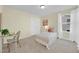 Cozy bedroom with neutral walls, carpet flooring, a bed, a desk, and natural light at 212 Brook Farm Ln, Fuquay Varina, NC 27526
