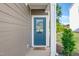 Inviting entryway features a blue front door with glass and a welcoming 