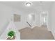 Bright hallway featuring neutral walls and carpet flooring with a teepee tent on the left at 212 Brook Farm Ln, Fuquay Varina, NC 27526
