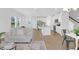 Spacious open-concept living space featuring hardwood floors and modern finishes at 212 Brook Farm Ln, Fuquay Varina, NC 27526
