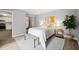 A cozy bedroom features a sliding door closet, a comfy bed, and ample natural light at 213 Summerwalk Cir, Chapel Hill, NC 27517
