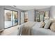 Bedroom with sliding doors to patio, mirrored closet, and light interior at 213 Summerwalk Cir, Chapel Hill, NC 27517