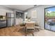 Bright dining space featuring a modern table and chairs, conveniently located near the kitchen and outdoor area at 213 Summerwalk Cir, Chapel Hill, NC 27517