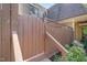 Charming townhome entrance featuring a wooden gate and stairs leading to the front door at 213 Summerwalk Cir, Chapel Hill, NC 27517