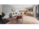 Bright open-concept living space with modern finishes, including a cozy fireplace and updated flooring at 213 Summerwalk Cir, Chapel Hill, NC 27517