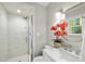 Newly renovated bathroom with a glass shower and vanity area, providing an elegant and functional space at 215 Westridge Dr, Raleigh, NC 27609