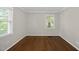 The bedroom has hardwood floors, neutral walls and a large window to allow natural light to enter at 215 Westridge Dr, Raleigh, NC 27609