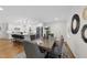 Comfortable dining room with wood table and seating for six, flowing to the updated kitchen and living spaces at 215 Westridge Dr, Raleigh, NC 27609
