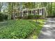 Charming single-story brick home with a well-maintained yard and mature landscaping at 215 Westridge Dr, Raleigh, NC 27609