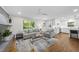 Open living area showcasing hardwood floors and natural light at 215 Westridge Dr, Raleigh, NC 27609