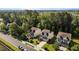 Aerial shot of a residential street featuring well-kept homes and lush green trees in a suburban setting at 221 Hammond Wood Pl, Morrisville, NC 27560