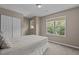 Neutral bedroom featuring carpet, closet, and bright windows at 221 Hammond Wood Pl, Morrisville, NC 27560