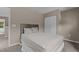Calm bedroom featuring neutral walls, soft carpeting, a comfortable bed, and plenty of closet space at 221 Hammond Wood Pl, Morrisville, NC 27560