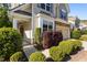 Covered front entry with landscaped yard and stone accents at 221 Hammond Wood Pl, Morrisville, NC 27560