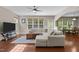 Spacious living room with wood floors and bright natural light at 221 Hammond Wood Pl, Morrisville, NC 27560