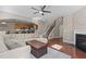 Open concept living room with fireplace and hardwood floors at 221 Hammond Wood Pl, Morrisville, NC 27560