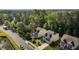 Scenic street view featuring well-maintained homes surrounded by lush greenery and mature trees at 221 Hammond Wood Pl, Morrisville, NC 27560