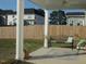 Spacious backyard featuring a covered patio, seating, and a well-maintained lawn at 222 Oak Branch Trl, Garner, NC 27529