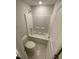 This well-lit bathroom boasts a shower and tub combination, toilet, and neutral tile flooring at 222 Oak Branch Trl, Garner, NC 27529