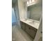 This bathroom features double sinks, tile flooring, and neutral colors, providing a clean and modern aesthetic at 222 Oak Branch Trl, Garner, NC 27529