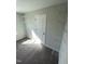 A secondary bedroom closet offers metal shelving and plenty of storage space at 222 Oak Branch Trl, Garner, NC 27529