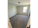 This bedroom showcases neutral carpet and a window, creating a relaxing and comfortable space at 222 Oak Branch Trl, Garner, NC 27529