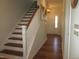 This home's entryway features hardwood floors, staircase and a warm and inviting ambiance to greet visitors at 222 Oak Branch Trl, Garner, NC 27529