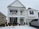 Charming two-story home with a covered porch and well-maintained lawn at 222 Oak Branch Trl, Garner, NC 27529