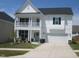 Charming two-story home with a covered porch and well-maintained lawn at 222 Oak Branch Trl, Garner, NC 27529