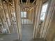 New construction interior framing shows an open floor plan with natural light from windows at 222 Oak Branch Trl, Garner, NC 27529
