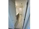 This hallway provides access to the home's bathrooms, featuring tiled floors and neutral color schemes at 222 Oak Branch Trl, Garner, NC 27529