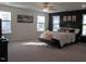 Bright main bedroom features a dark accent wall and plentiful natural light from multiple windows at 222 Oak Branch Trl, Garner, NC 27529