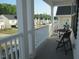This home features a private covered porch, creating a welcoming outdoor area with comfortable seating at 222 Oak Branch Trl, Garner, NC 27529