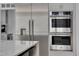 Kitchen area showcasing stainless steel appliances, including a refrigerator and built-in double oven at 2306 Byrd St, Raleigh, NC 27608