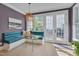 Charming breakfast nook with banquette seating, glass table, and view to the backyard at 2306 Byrd St, Raleigh, NC 27608