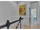 Hallway with artwork and view into a bright white bathroom at 2306 Byrd St, Raleigh, NC 27608