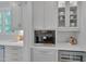Modern kitchen with Miele coffee maker, marble countertop, white cabinets, and stainless steel appliances at 2306 Byrd St, Raleigh, NC 27608