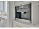 Built-in Miele coffee maker surrounded by bright white cabinetry and marble countertops at 2306 Byrd St, Raleigh, NC 27608