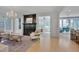 Bright and airy living room with large windows, hardwood floors, and elegant chandelier at 2306 Byrd St, Raleigh, NC 27608
