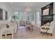 Charming living room with fireplace, chandelier, neutral furniture, and a decorative rug at 2306 Byrd St, Raleigh, NC 27608