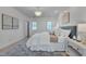 Bright main bedroom with white bedding, bedside tables, and modern lighting at 2306 Byrd St, Raleigh, NC 27608