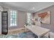 Well-lit office with a modern white desk, large windows, and a stylish accent rug at 2306 Byrd St, Raleigh, NC 27608
