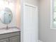 Bright bathroom with a granite countertop, modern fixtures and a large shower at 2405 Flints Pond Cir, Apex, NC 27523